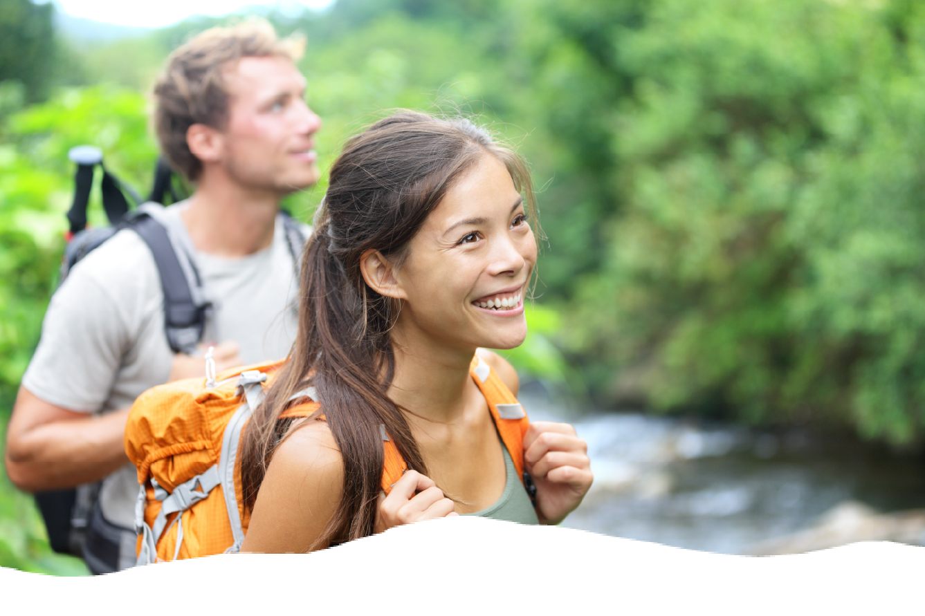Parent and teen child hiking.