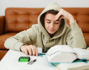 Teen going over school work